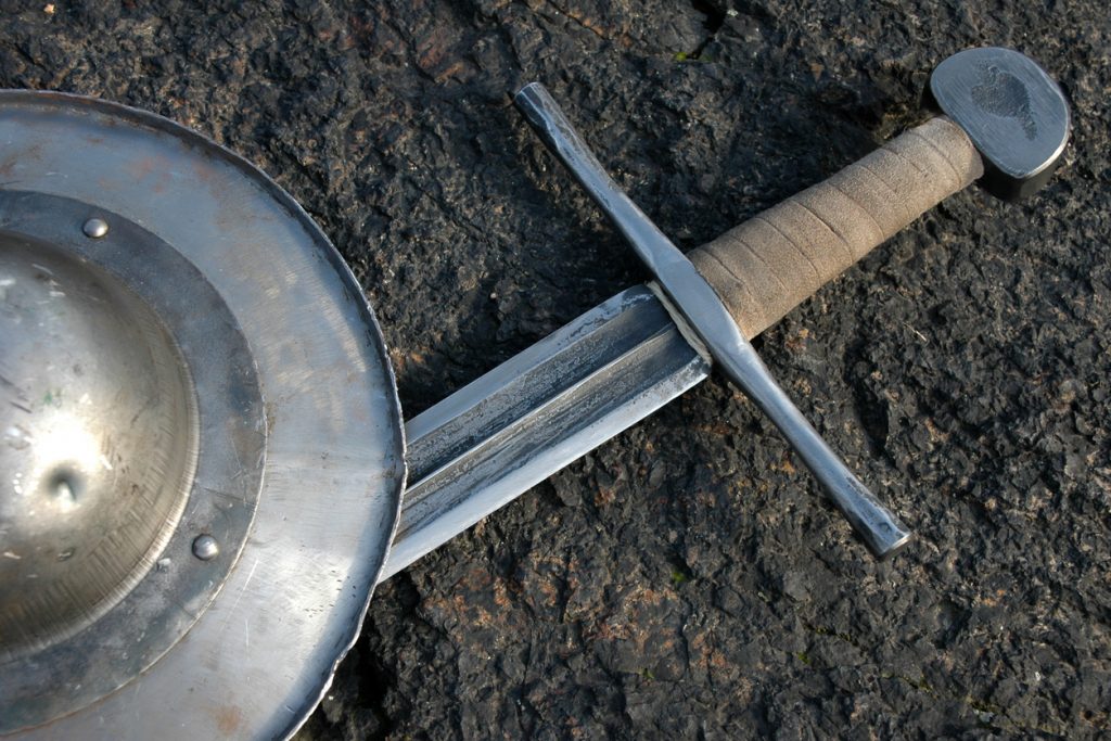 Sword and shield laying on the ground